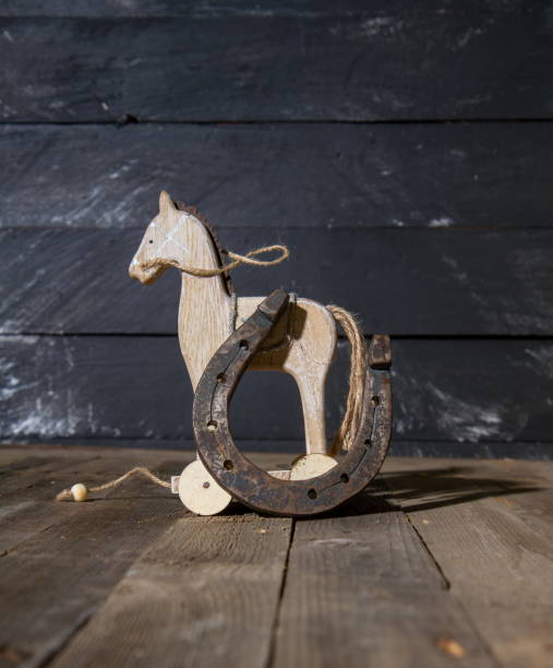 istock wooden horse horseshoe 1204220508