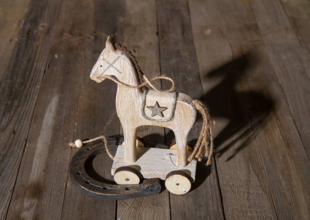 istock wooden horse horseshoe 1204221087