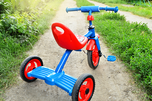 Colorful Plastic Tricycle , This is a 3d rendered computer generated image. Isolated on white.
