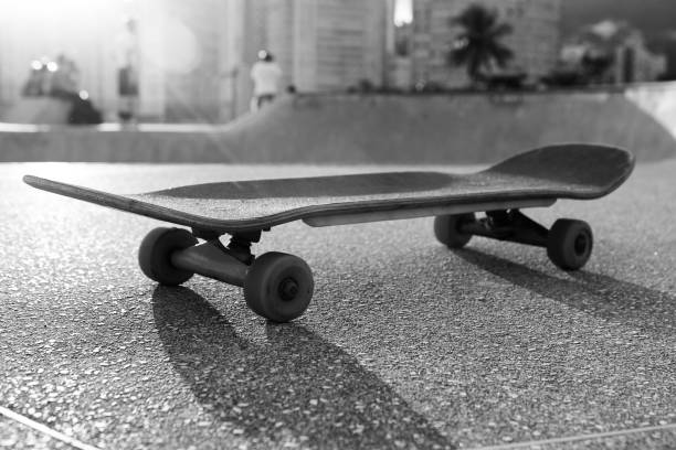istock Skateboard on the edge of a bowl 1204221624