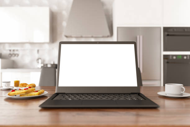 istock Blank Screen Laptop in the Kitchen with Coffee and Pancake 1204221953