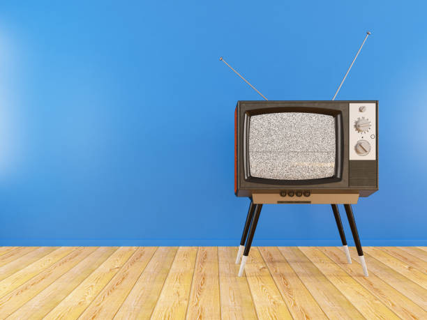 istock Old Retro TV Against Blue Wall 1204222039