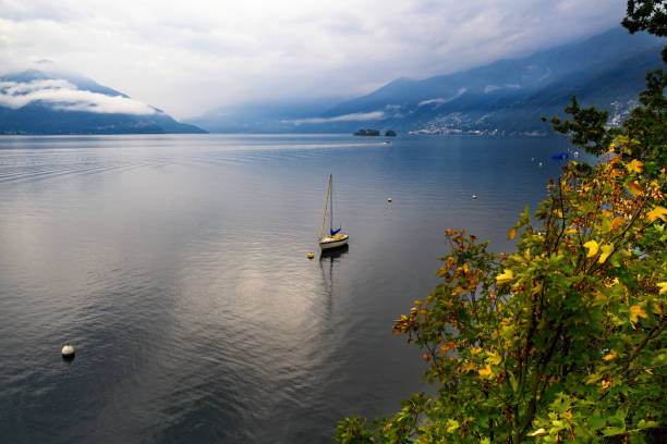 boat on lake maggiore, panoramic photo. - buoy horizontal lake sailing imagens e fotografias de stock