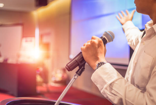 istock the man hold microphone on the stage 1204225227