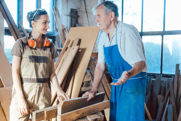istock Senior carpenter sharing wisdom with younger aspiring colleague 1204225978