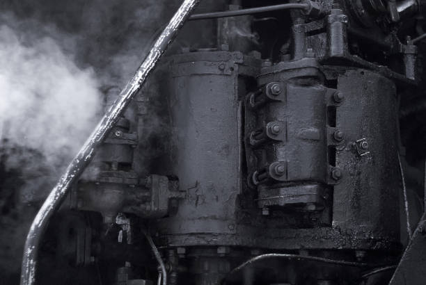 black industrial background - fragment of a working vintage steam engine