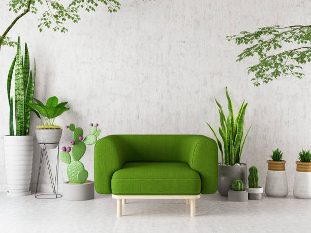 sessel mit grünen pflanzen blumen und kakteen - furniture design indoors armchair stock-fotos und bilder