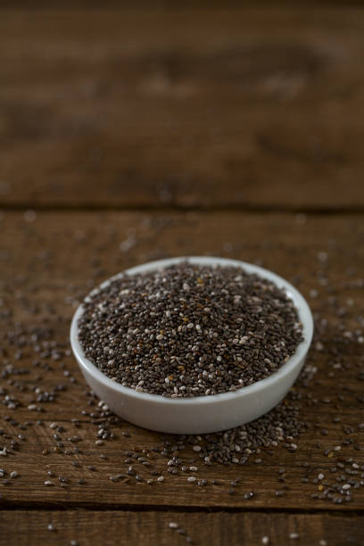 istock Chia seeds on a wooden surface 1204229083