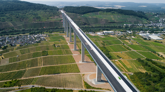 Construction site of Hochmoselbruecke B50, bridge over Mosel valley - aerial view