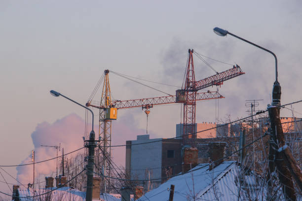 istock Large construction site with construction cranes and tall houses 1204233278