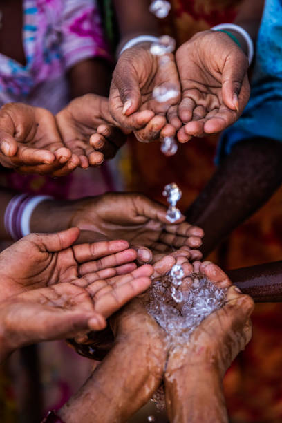 istock Poor Indian children asking for fresh water, India 1204233326