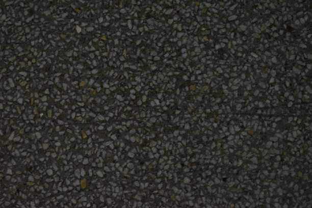 istock Concrete floor covering with cracks and inclusions 1204233368