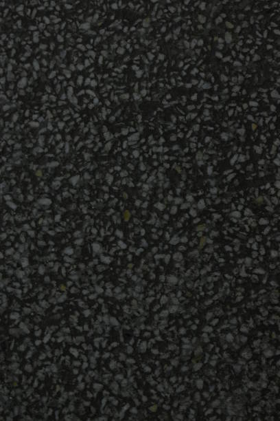 istock Concrete floor covering with cracks and inclusions 1204234105