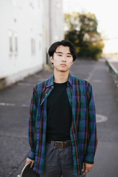 istock Portrait of Asian Skateboarder 1204236043