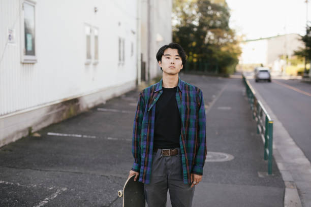 istock Portrait of Asian Skateboarder 1204236080