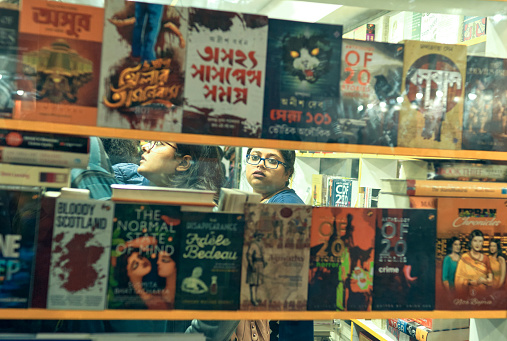 Visitor inside Central Park Fair Ground, Salt Lake on the occasion of 44th International Kolkata Book Fair 2020. Interior of a book stall. People taking a look at display of books.
Kolkata Book Fair is world's largest non-trade book fair, Asia's largest book fair and the most attended book fair held annually during winter season. Photo taken at Kolkata, West Bengal on 02/02/2020.