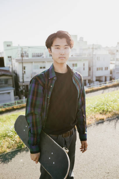 istock Portrait of Asian Skateboarder 1204236209