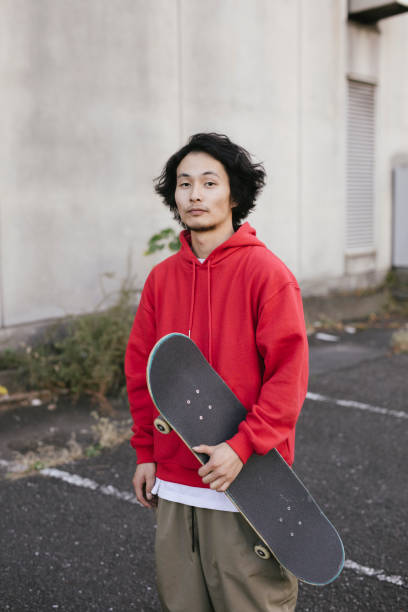 istock Portrait of Asian Skateboarder 1204236255
