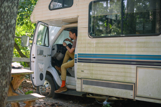 istock Man getting out of recreational vehicle 1204236349