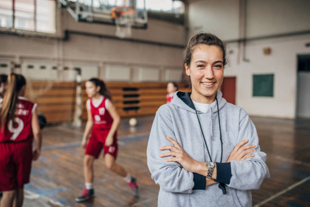 istock Female coach and basketball team 1204236563