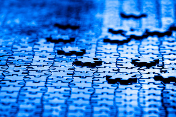 istock Puzzle pieces on table solving a game for fun and achievement jigsaw 1204238554