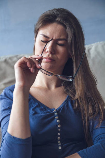 istock Woman with glasses reading a book 1204240206