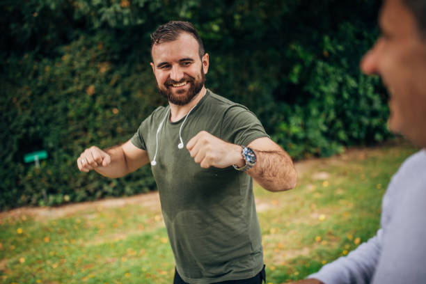 istock Father and son jogging in park 1204240546