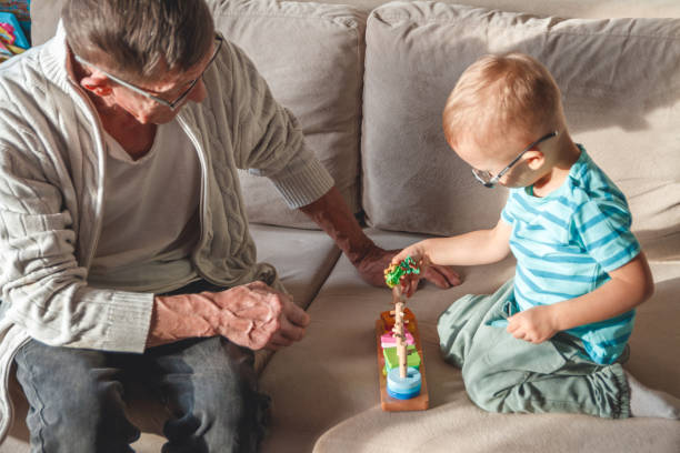 istock grandfather plays with his little grandson 1204240747