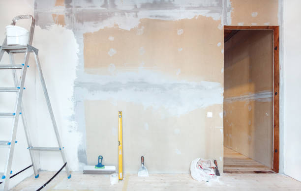 istock A stepladder with painting tools in a room. Preparing for putty 1204242323