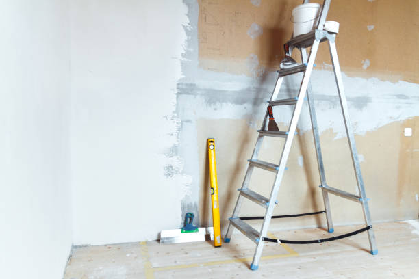 istock A stepladder with painting tools in a room. Preparing for putty 1204242335