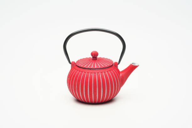 istock Red cast iron teapot on a white background. 1204243516