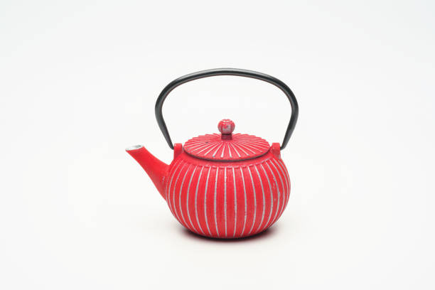 istock Red cast iron teapot on a white background. 1204243518