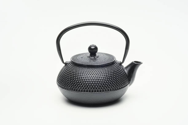 istock Black cast iron teapot on a white background. 1204244051