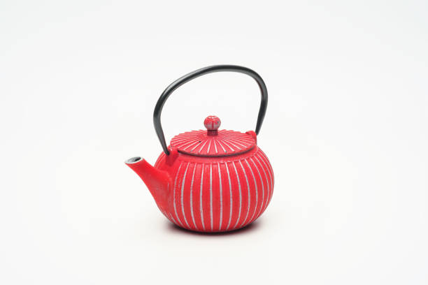 istock Red cast iron teapot on a white background. 1204244132