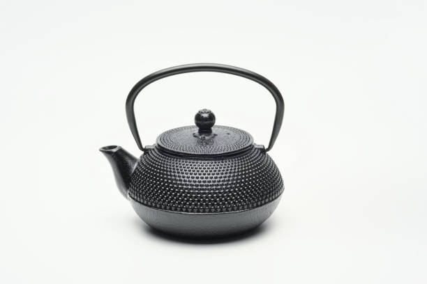 istock Black cast iron teapot on a white background. 1204244139