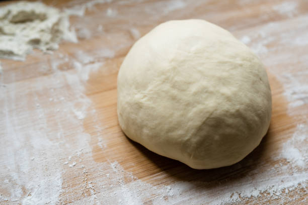 istock Preparetion dough of bread on the table 1204244836