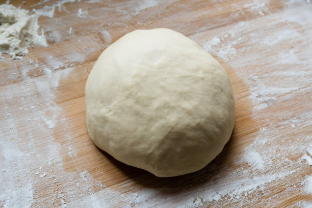 istock Preparetion dough of bread on the table 1204245107