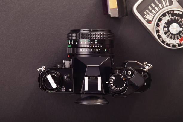 istock Professional vintage SLR analog film camera with a lightmeter 1204250791