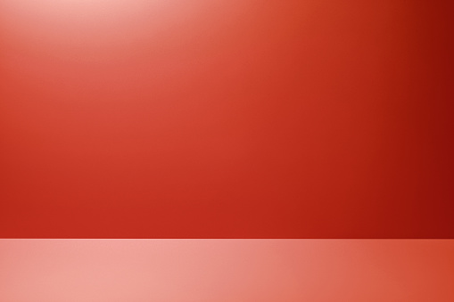 Red Studio Background for product placement or as a design template with wall angle in a full frame view
