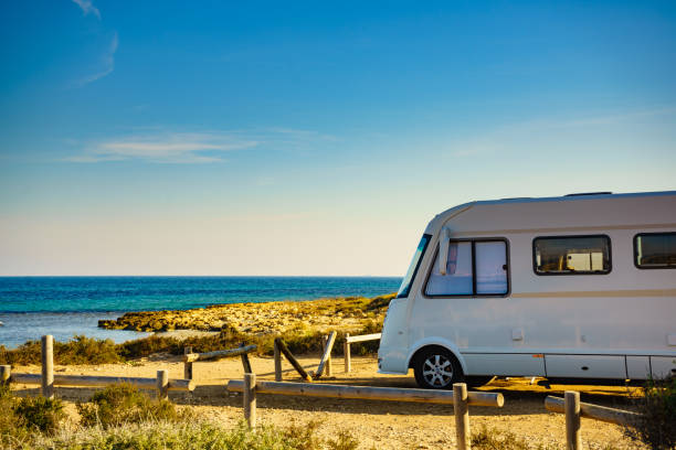 istock Camper car on beach, camping on nature 1204254323