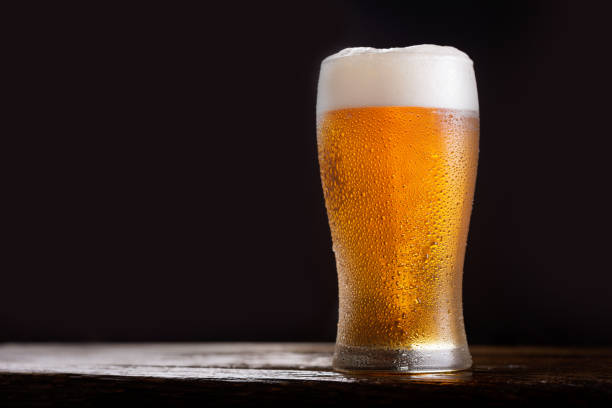 istock glass of beer on dark background 1204256542