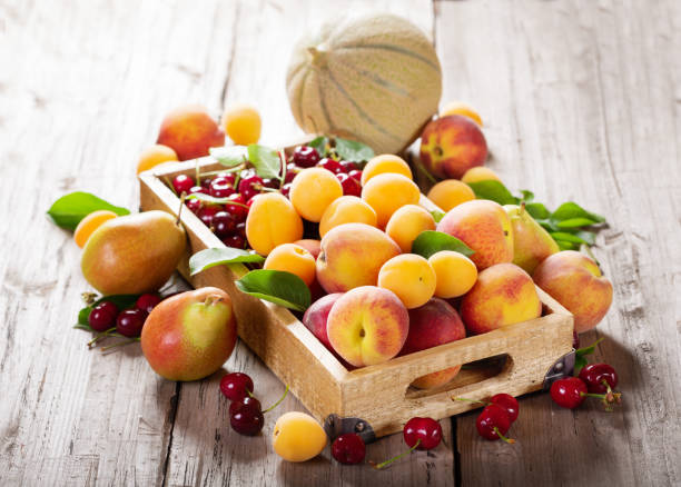 istock fresh ripe fruits in a wooden box 1204256576