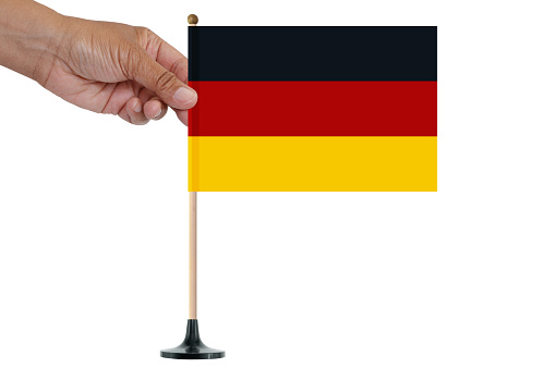 Hand holding Germany flag  wood pole white background
