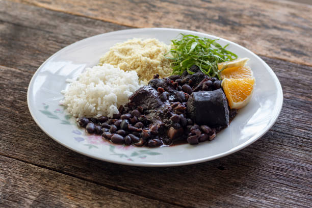 istock Brazilian feijoada food - Wooden background 1204264923