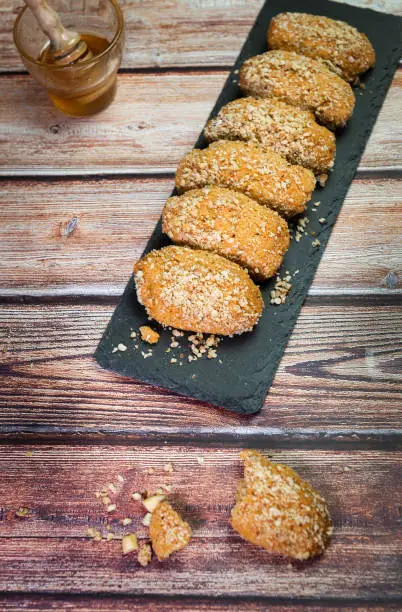 Delicious and tasty Greek  honey cookies with Walnuts called melomakarona , traditionally enjoyed during Christmas.