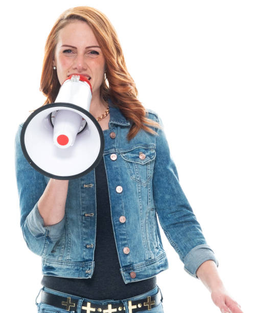 istock Caucasian female wearing double denim and holding megaphone 1204265802