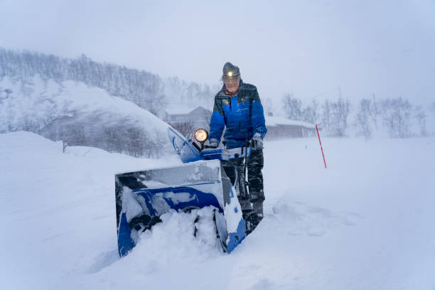 istock man with snowblower in winter storm 1204266385