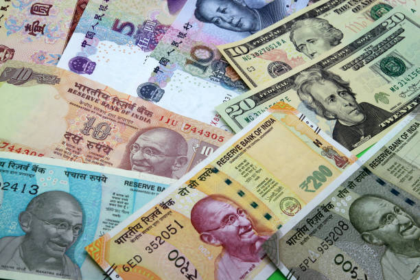 istock Assorted American and asian paper money background. 1204267526