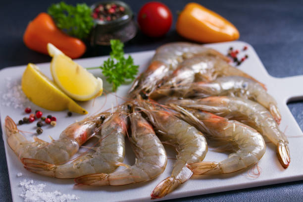 istock Fresh raw pacific whole shrimps with ingredients 1204267680
