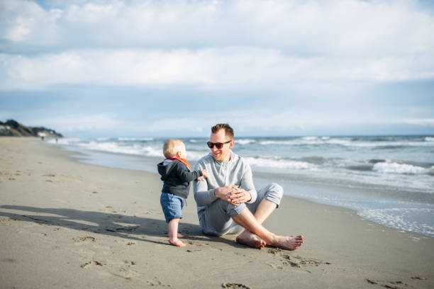 istock Dad with baby boy spend time together on the beach 1204267865